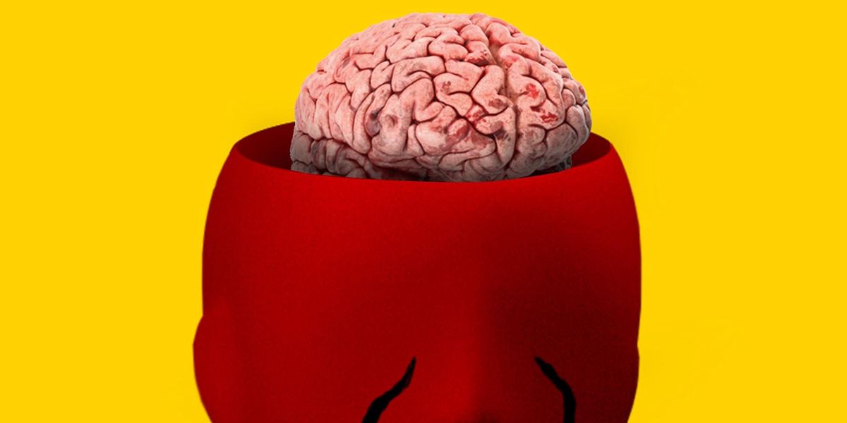 Emberi fejforma és a benne lévő agy, sárga háttée előtt