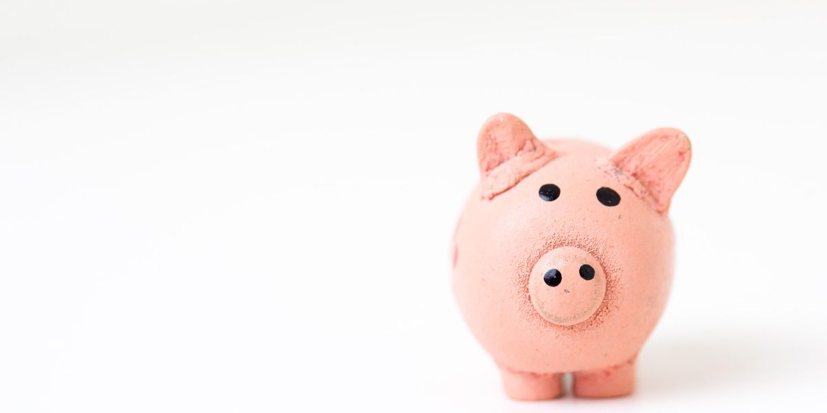 pink pig figurine on white surface