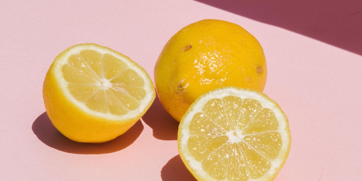 sliced lemon on orange table