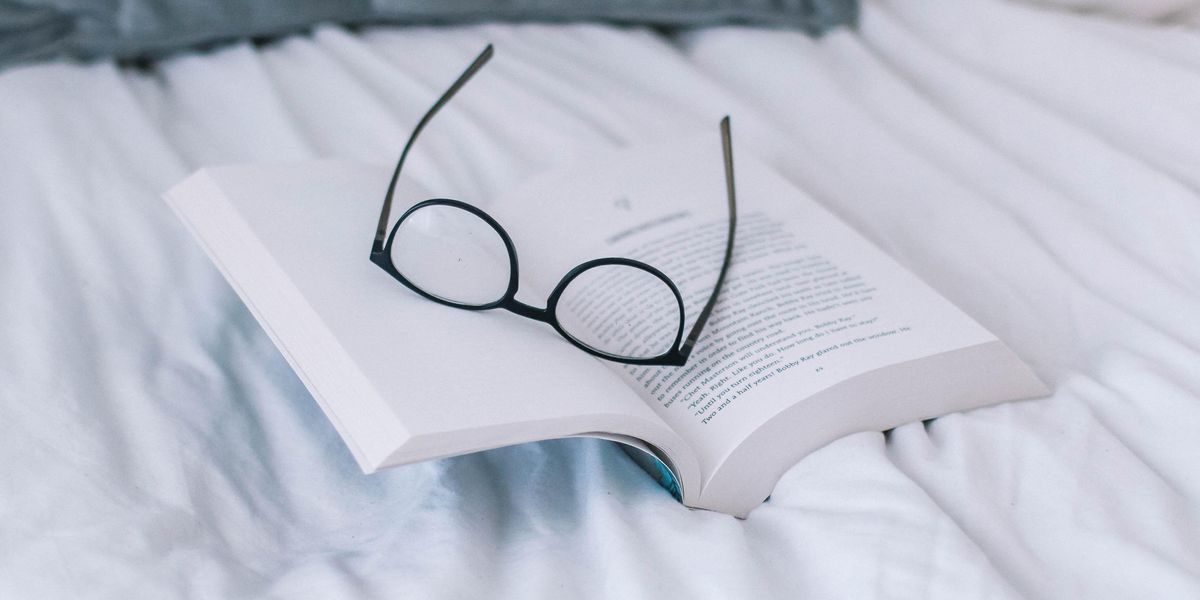 black framed eyeglasses on book page