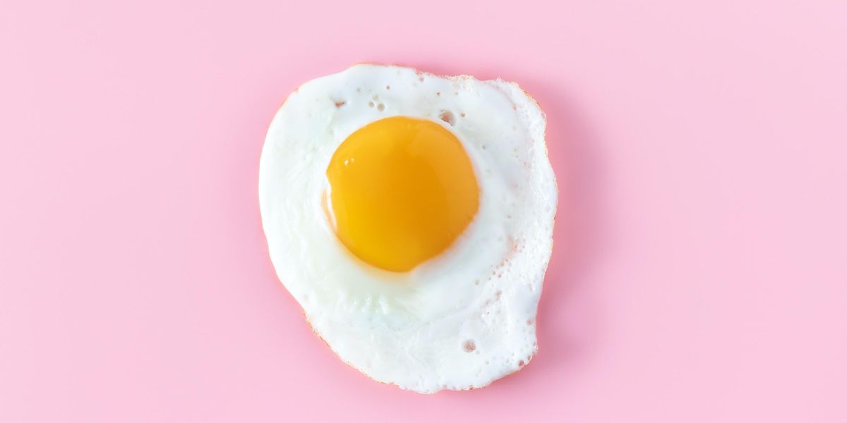 sunny side up egg on pink surface