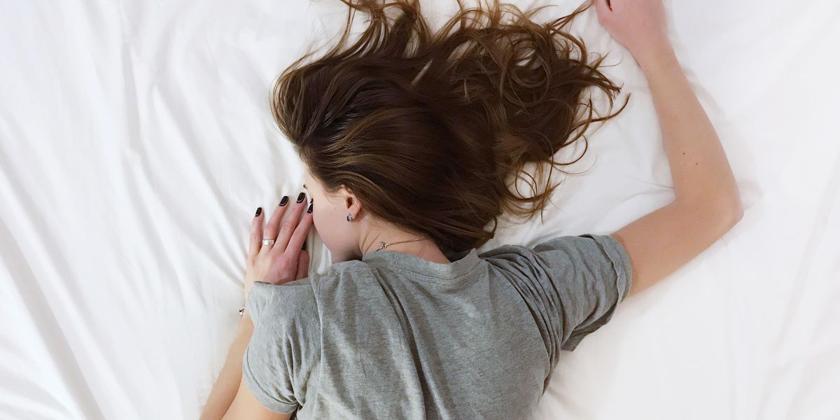 woman laying on bed