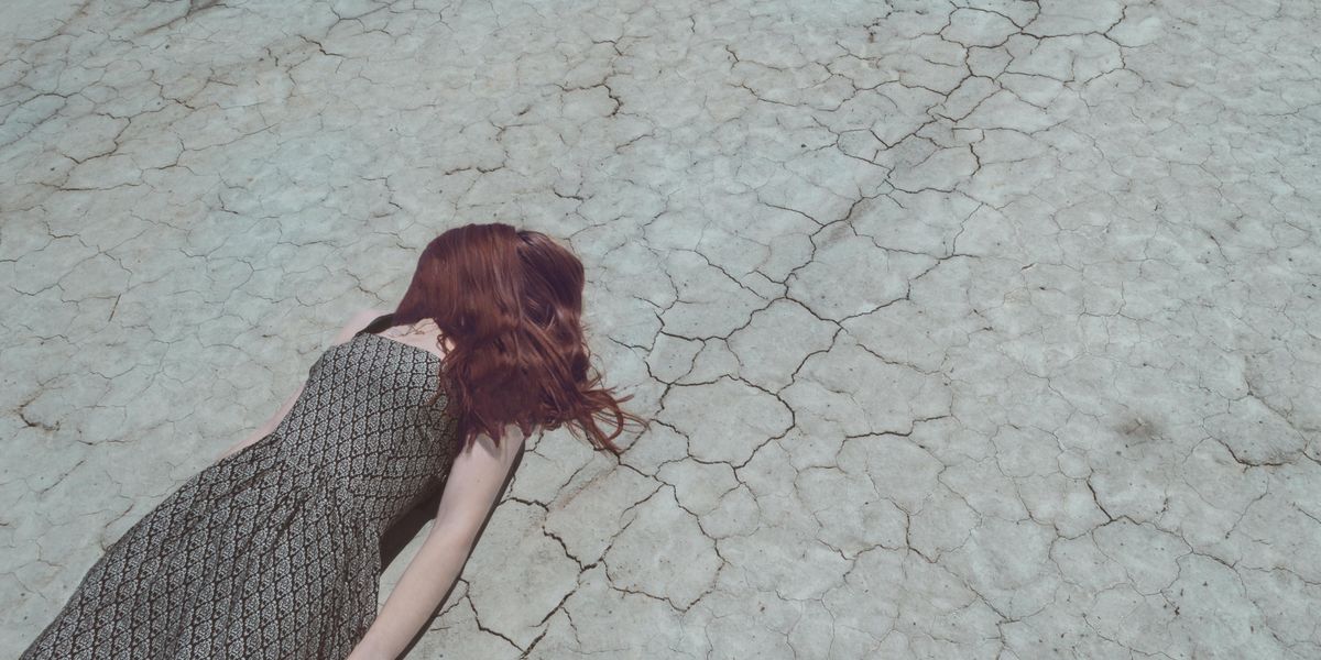 woman lying on ground