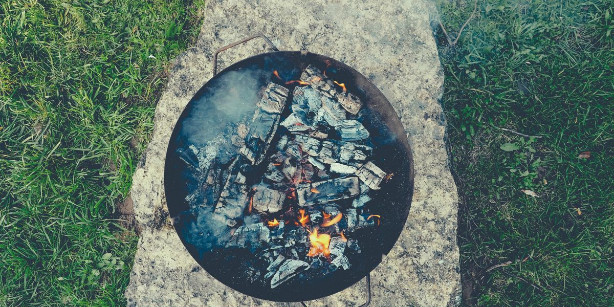 black round concrete fire pit